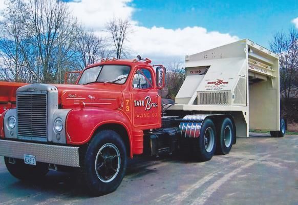 A red truck with the word tate on the side