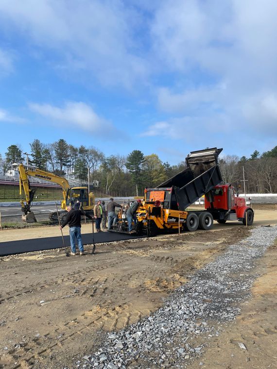 A roller is rolling asphalt on a road A roller is rolling asphalt on a road