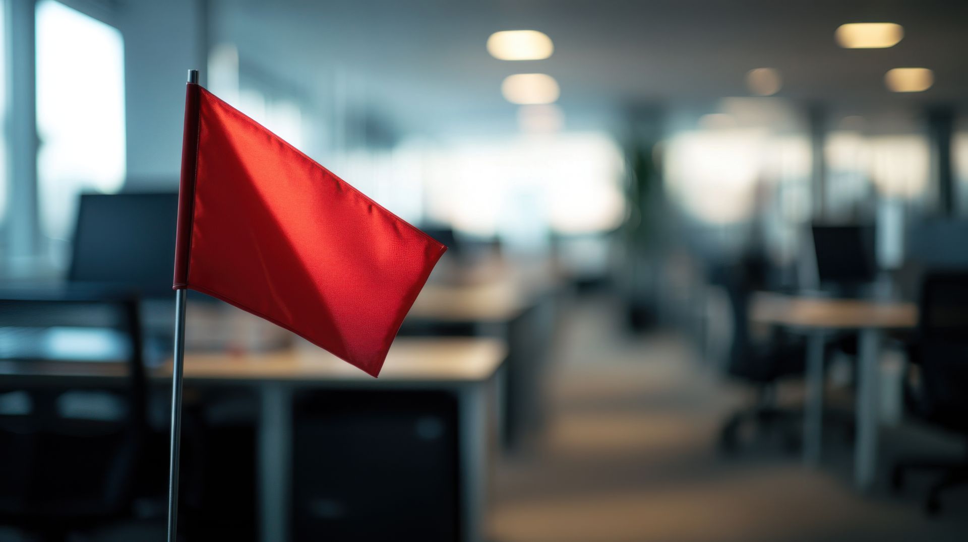 red flag at a desk in an office building