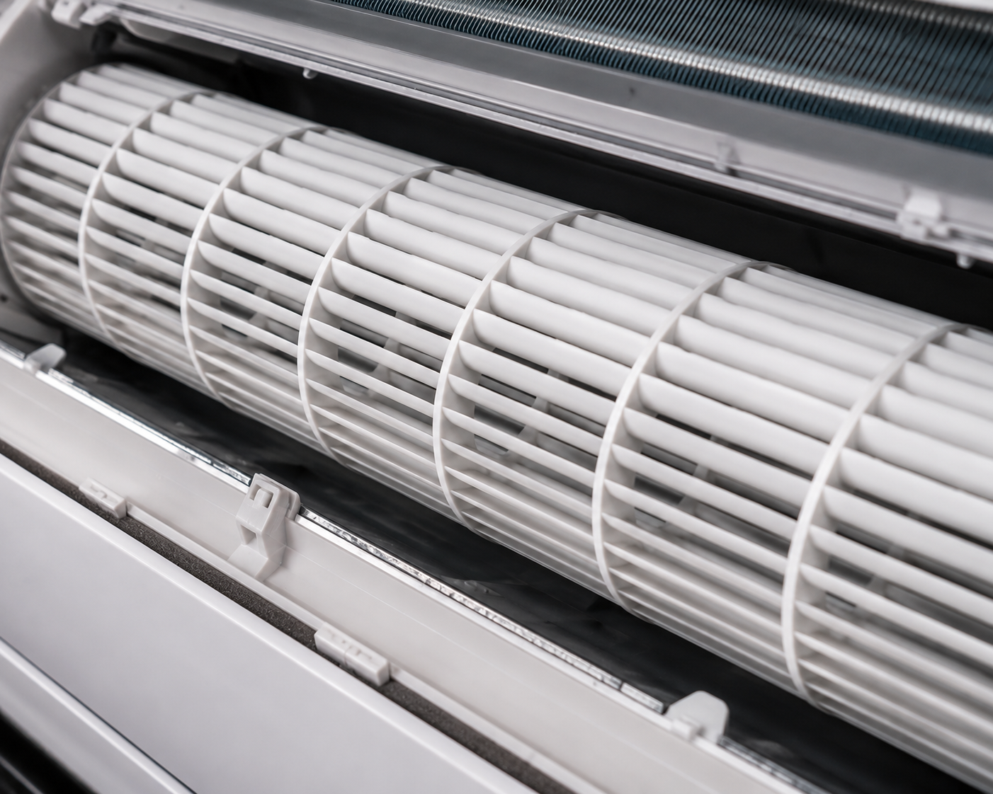 Close-up of a white cylindrical filter or fan inside a metal ventilation housing