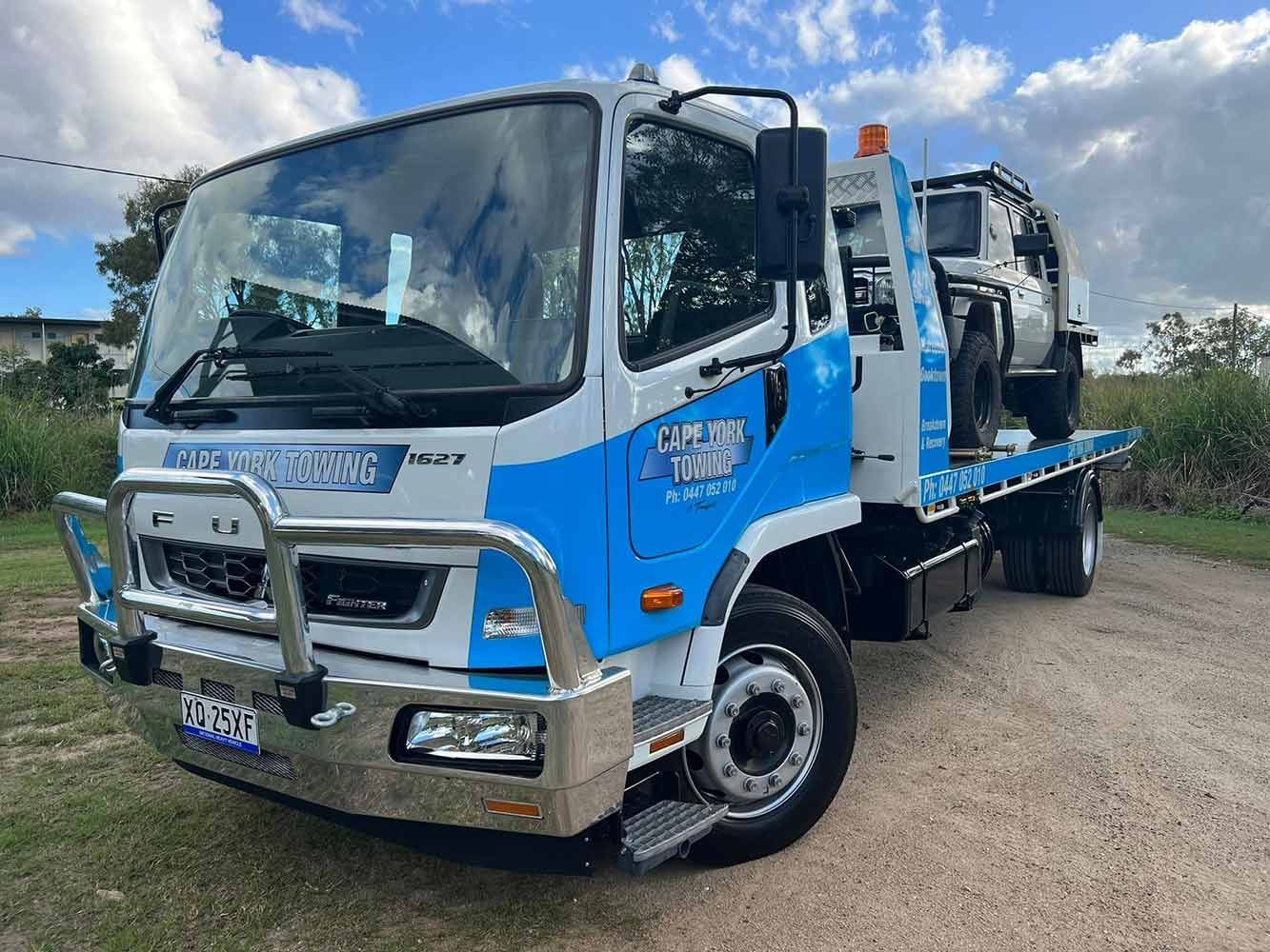 A Blue and White Tow Truck is Parked on a Dirt Road — Cape York Towing in South Australia, AUS