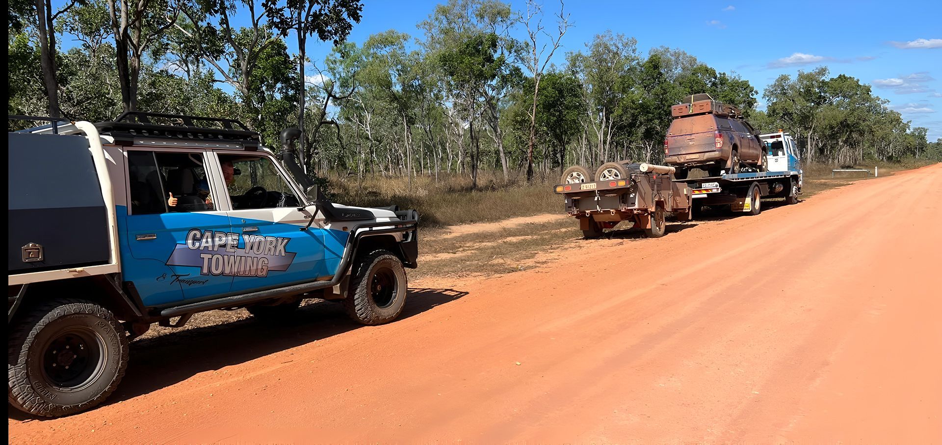 A Blue Truck is Parked on the Side of a Dirt Road — Cape York Towing & Transport in Pormpuraaw, QLD