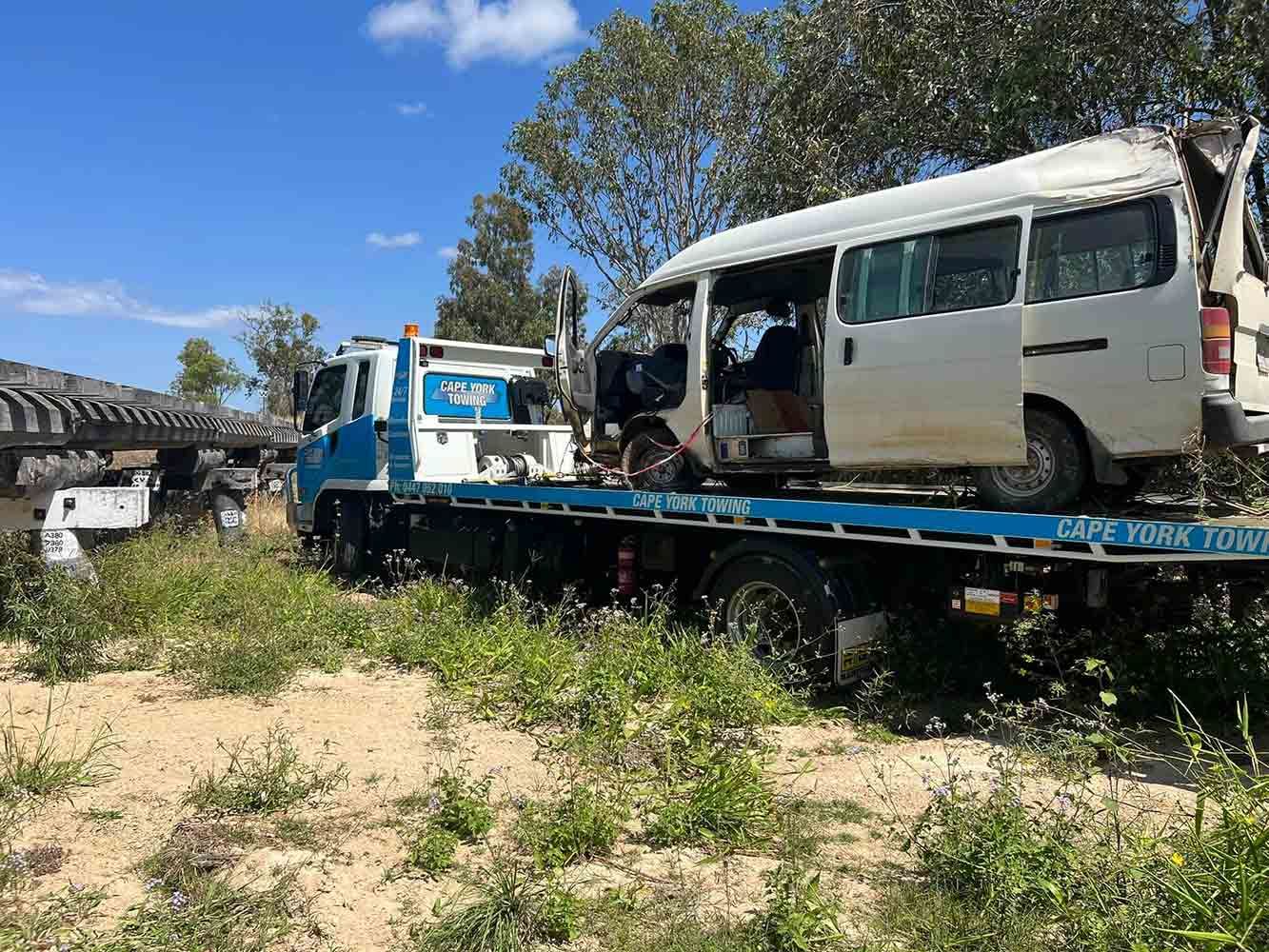 A White Van is Sitting on Top of a Tow Truck — Cape York Towing & Transport in Lockhart River, QLD