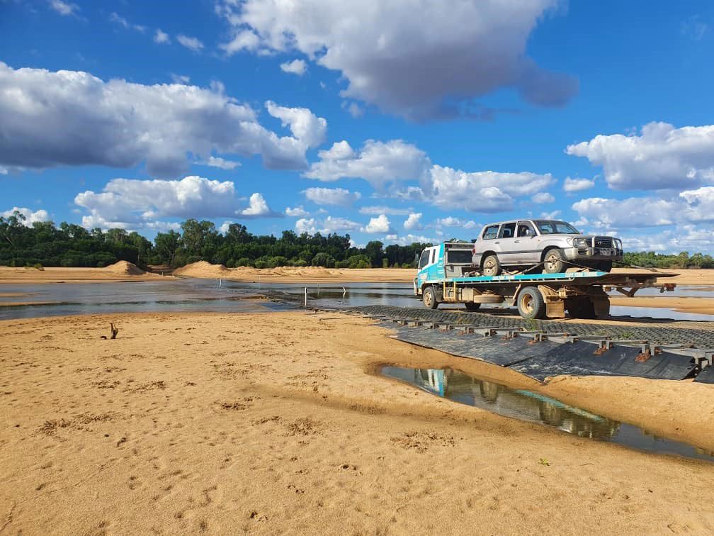 A Tow Truck is Carrying a Car on the Back of It — Cape York Towing in Hann River, QLD