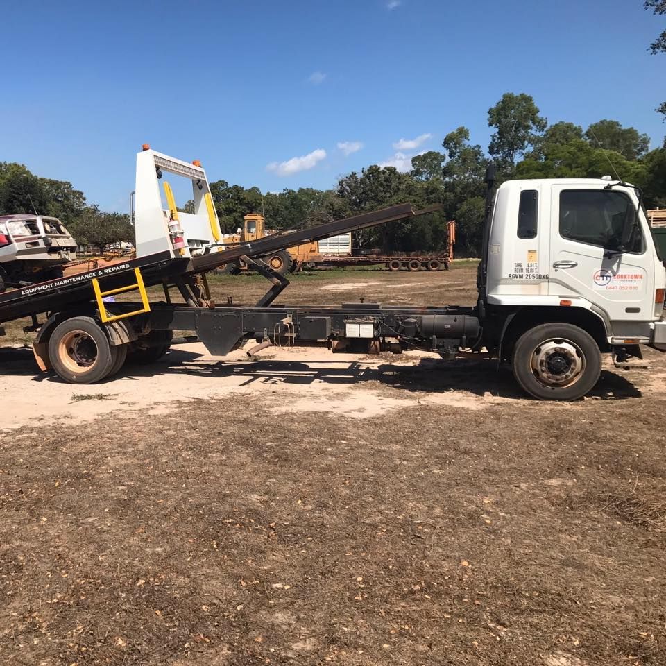 A White Tow Truck is Parked in a Dirt Field — Cape York Towing & Transport in Kowanyama, QLD