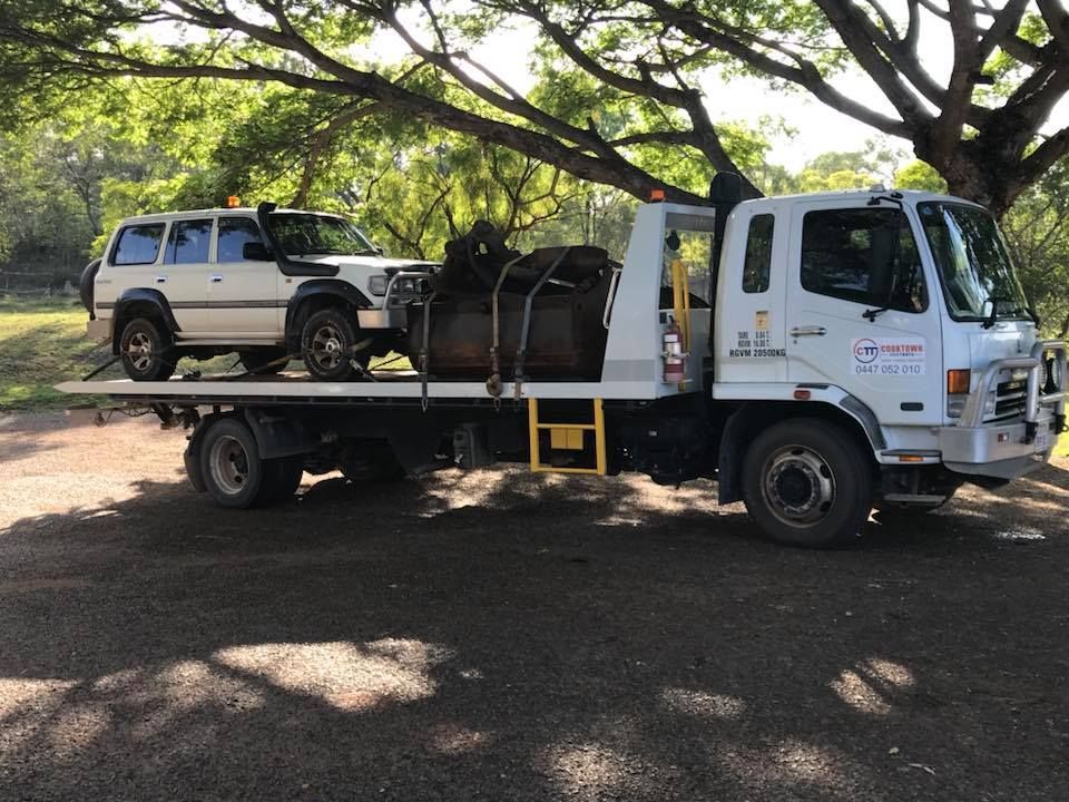 A White Tow Truck is Carrying a White SUV on Its Flatbed — Cape York Towing & Transport in Pormpuraaw, QLD