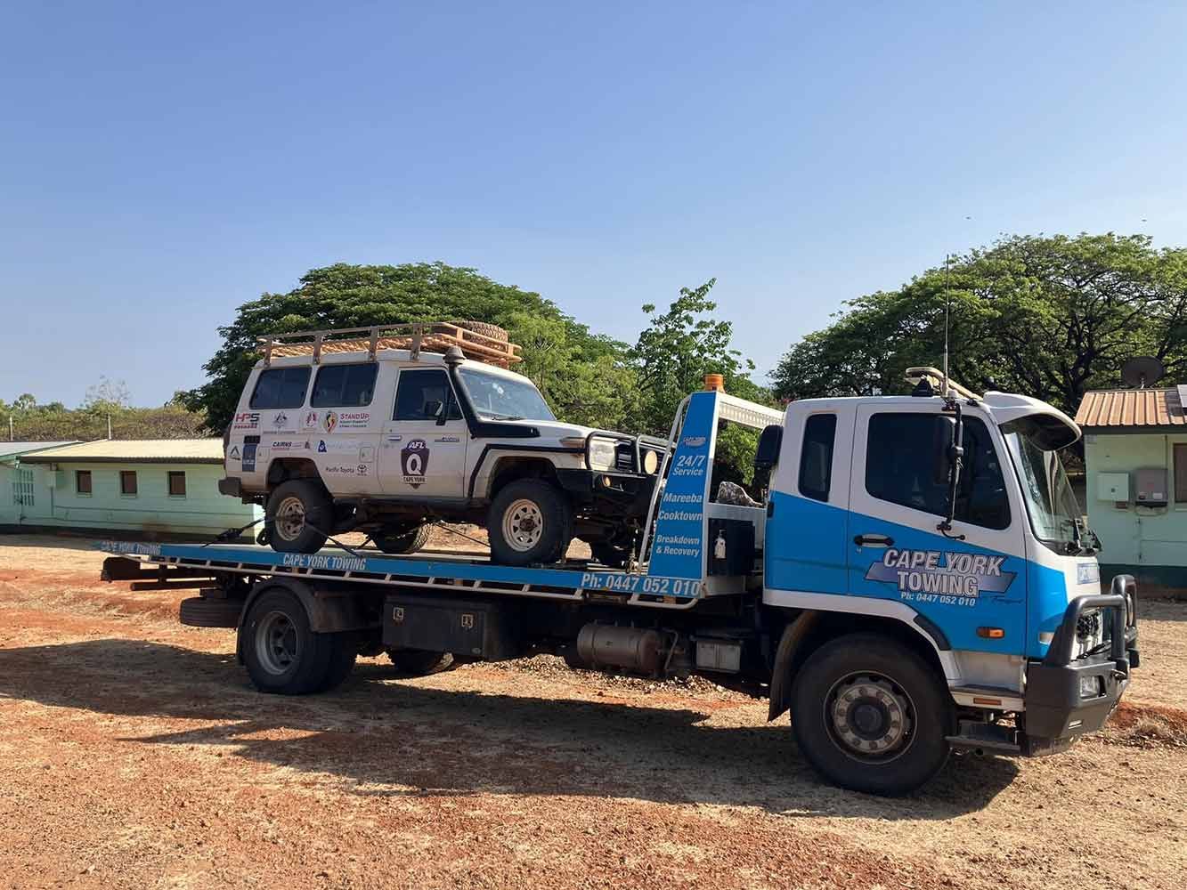 A Tow Truck is Carrying a Jeep on the Back of It — Cape York Towing & Transport in Mareeba, QLD