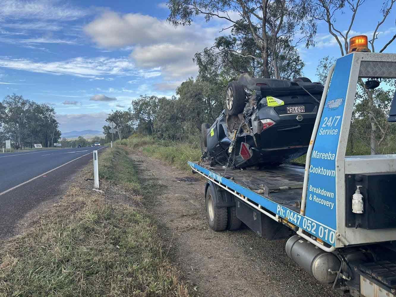 A Tow Truck is Towing a Car That Has Crashed on the Side of the Road — Cape York Towing & Transport in Musgrave, QLD