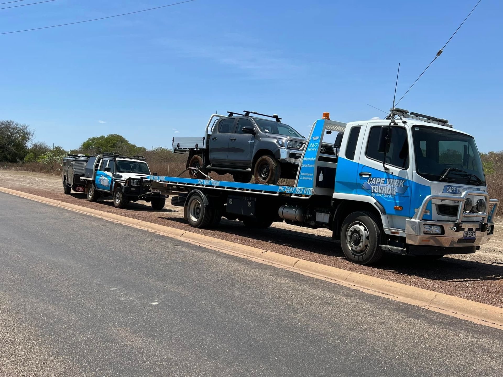 Grey Car on Towing Service Truck