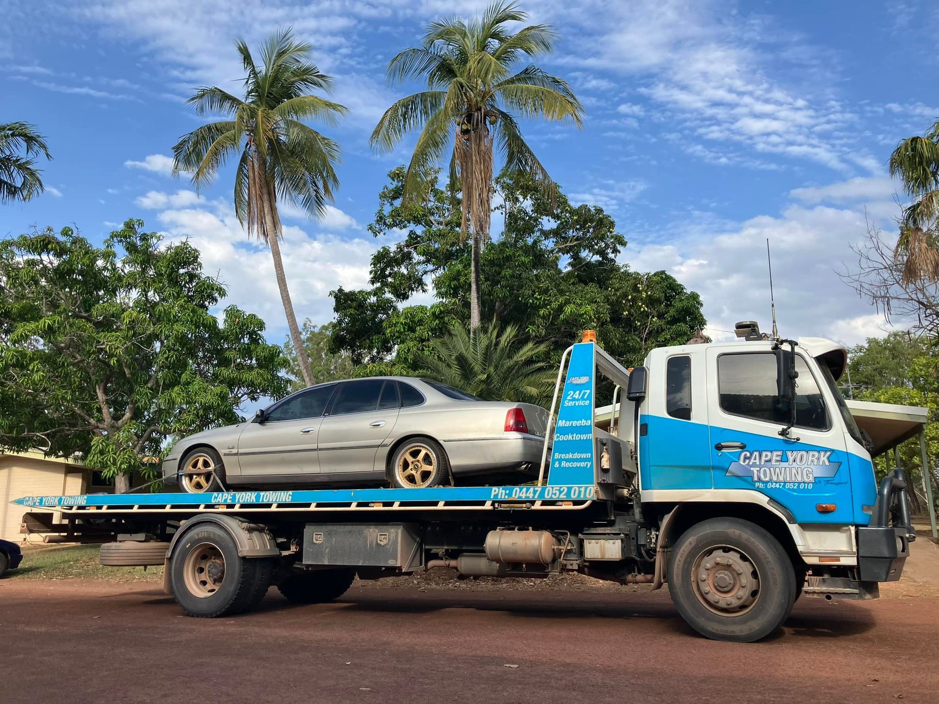 Tow Truck with White Car on Its Bed — Cape York Towing & Transport in Mareeba, QLD
