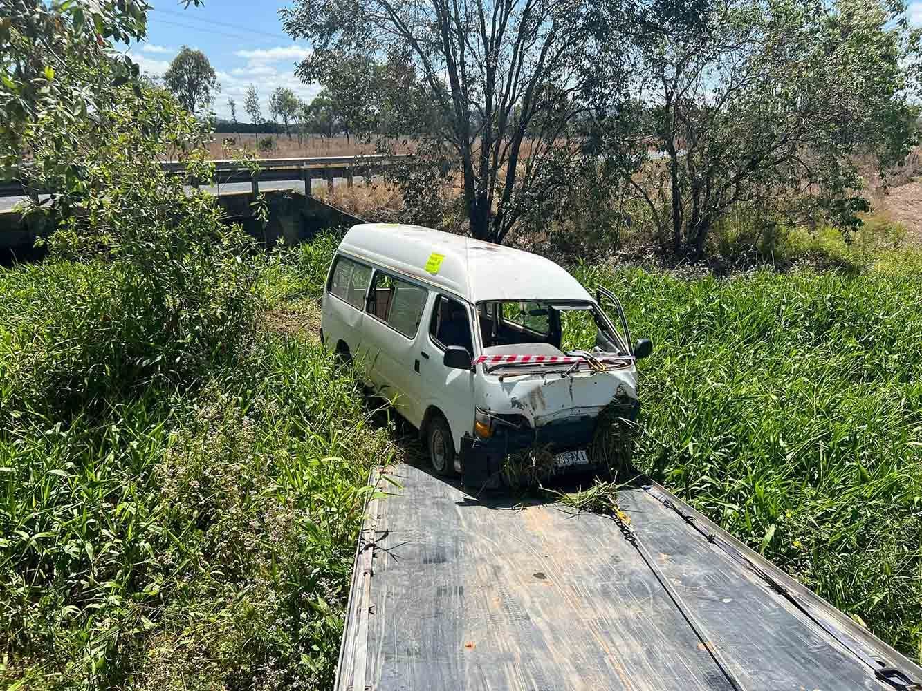 A White Van is Stuck in the Mud on a Wooden Bridge — Cape York Towing & Transport in Chillagoe, QLD