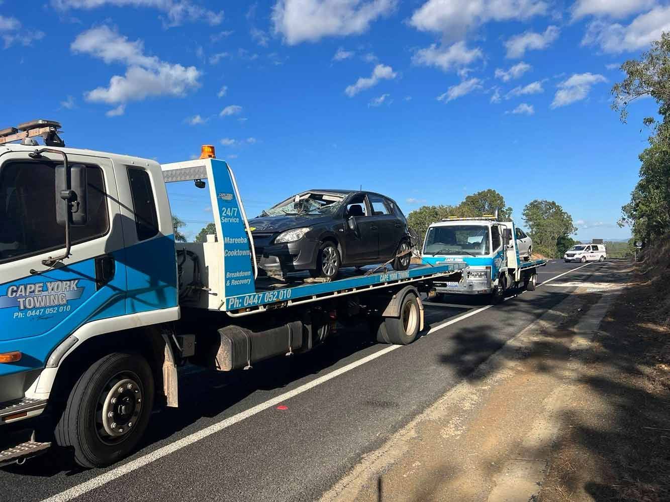 A Tow Truck is Carrying a Car on the Back of It — Cape York Towing in Tablelands, QLD