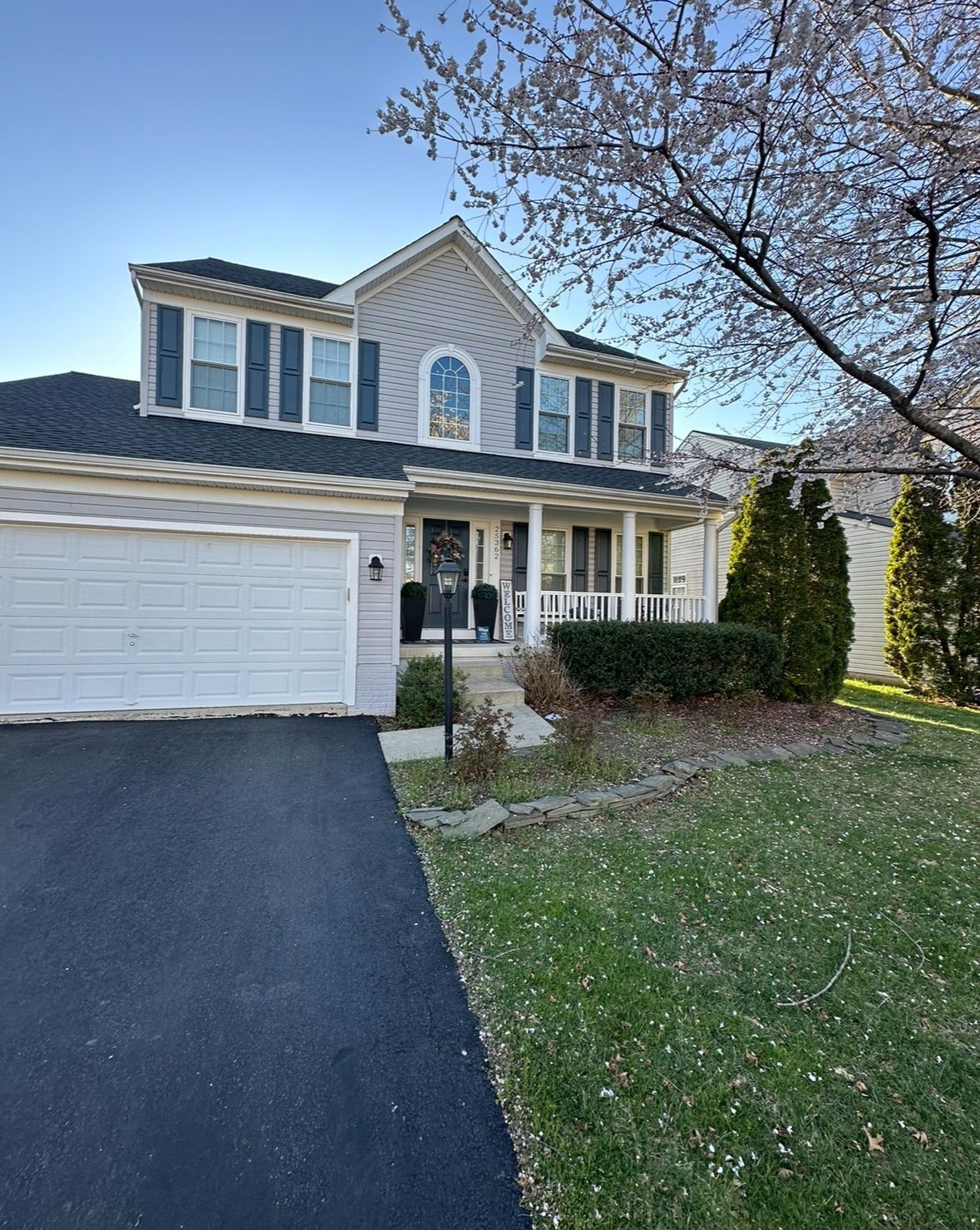 A large house with a driveway leading to it