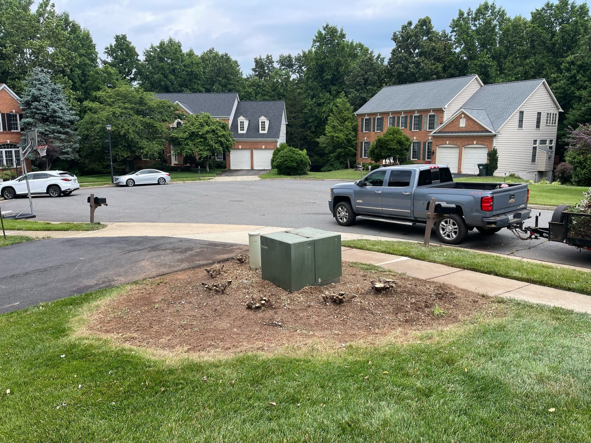 A truck is parked on the side of the road in a residential neighborhood.