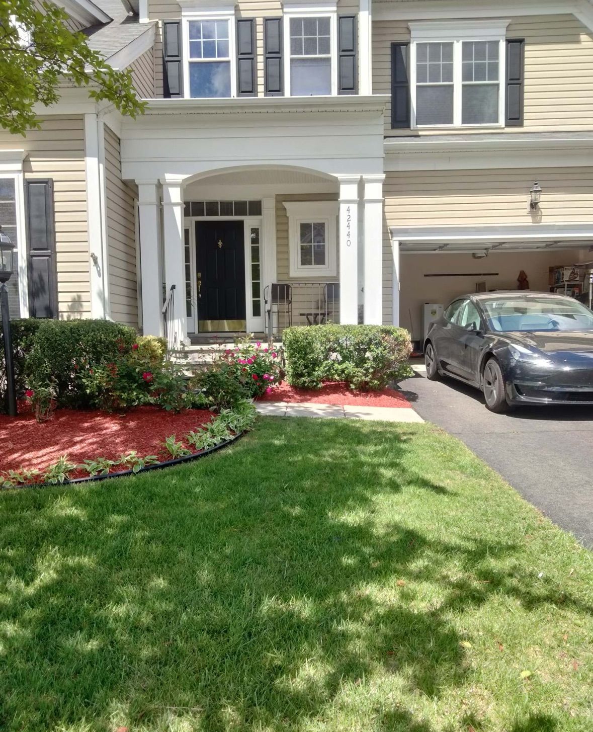 A car is parked in front of a house.