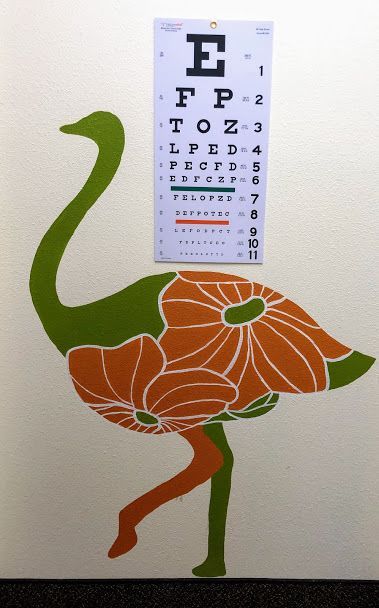 A painting of an ostrich with a eye chart behind it