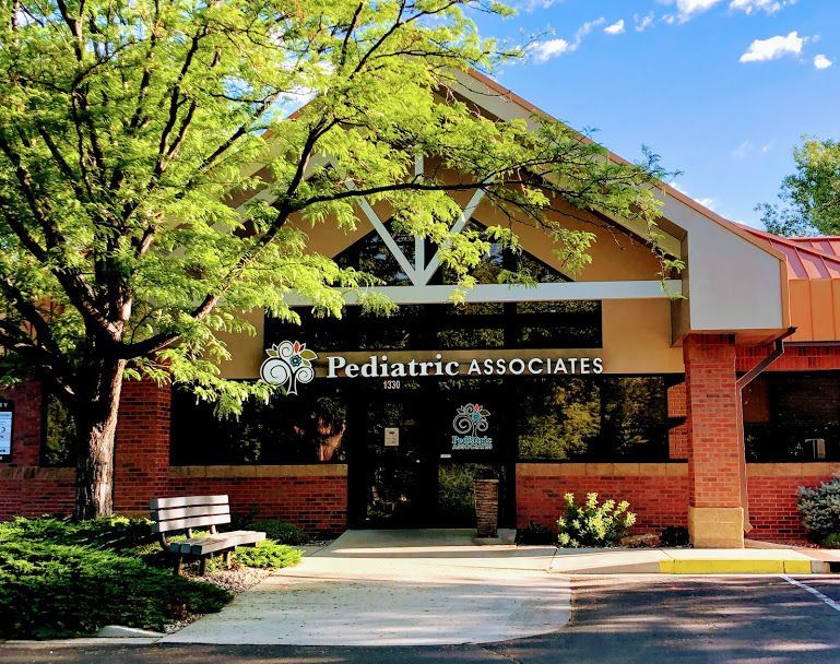 A pediatric associates building with a red roof