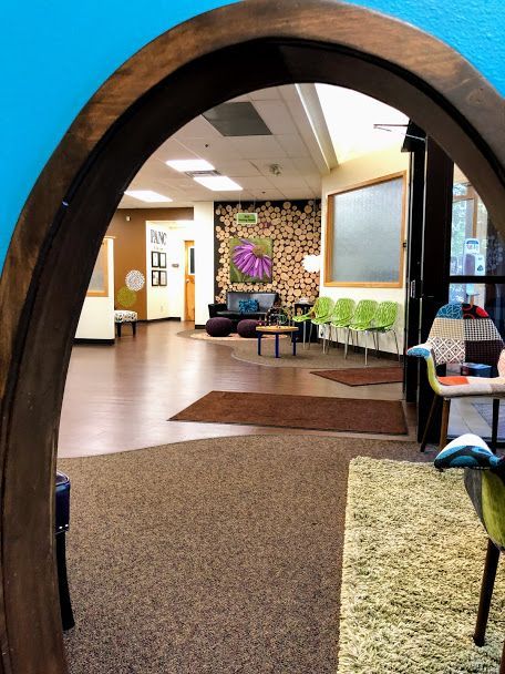 A view of a room through a wooden archway
