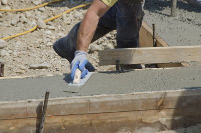 professional contractor finishing the footings for a residential slab job in kelowna bc