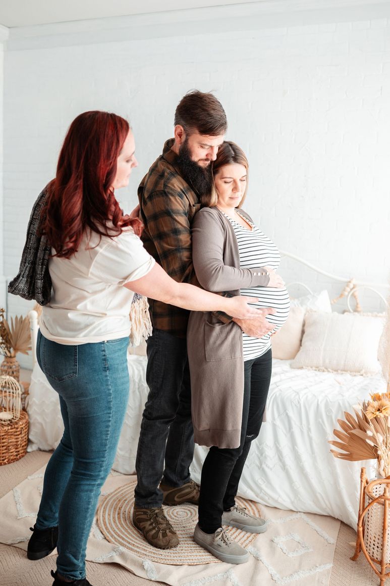 doula educating pregnant couple