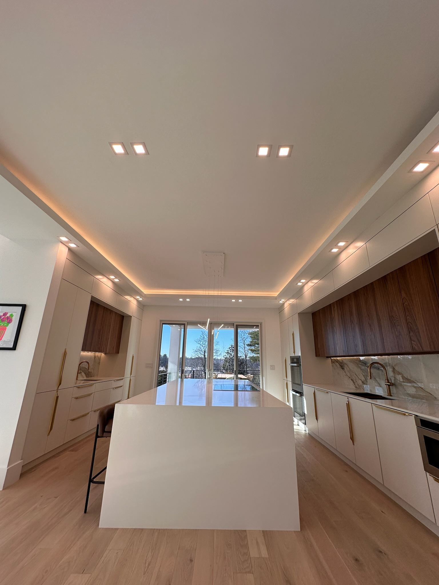 There is a large island in the middle of the kitchen.