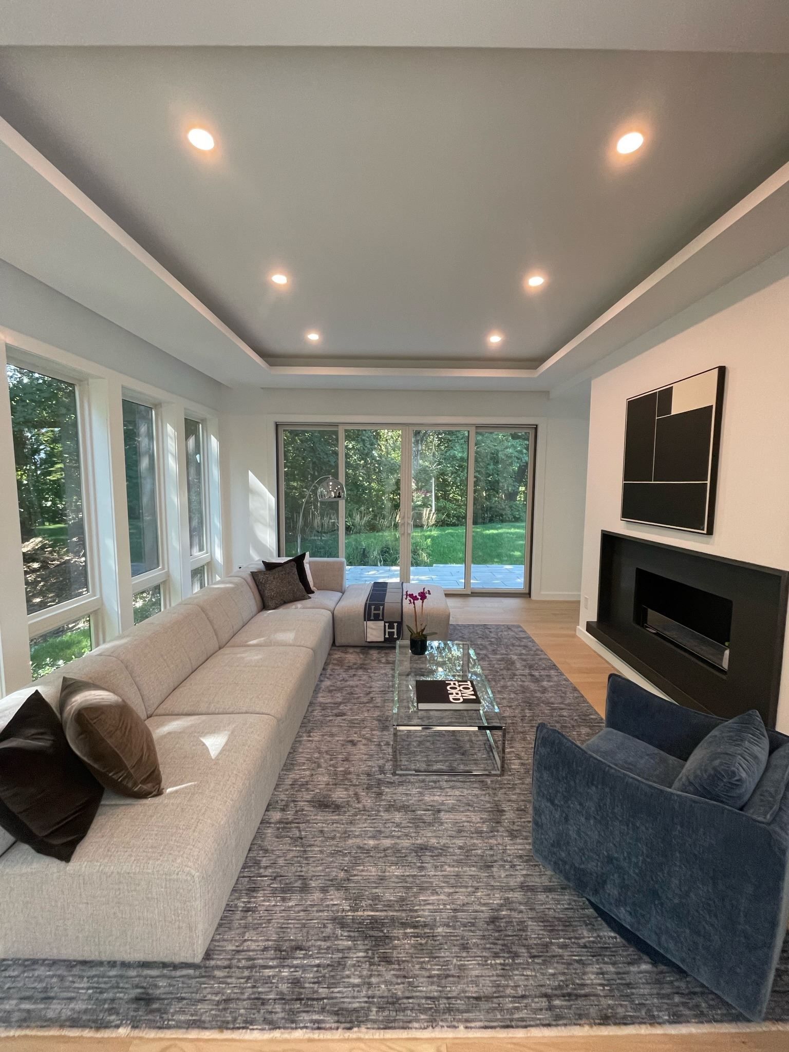 A living room with a couch a chair and a fireplace