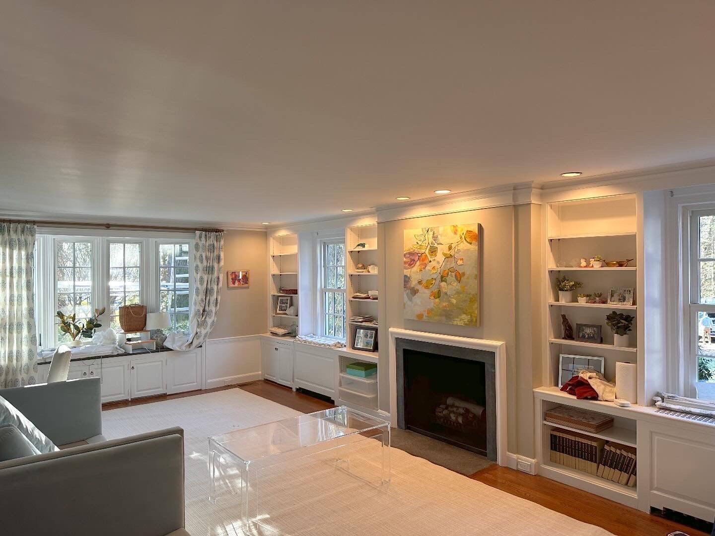 There is a fireplace in the middle of the living room.