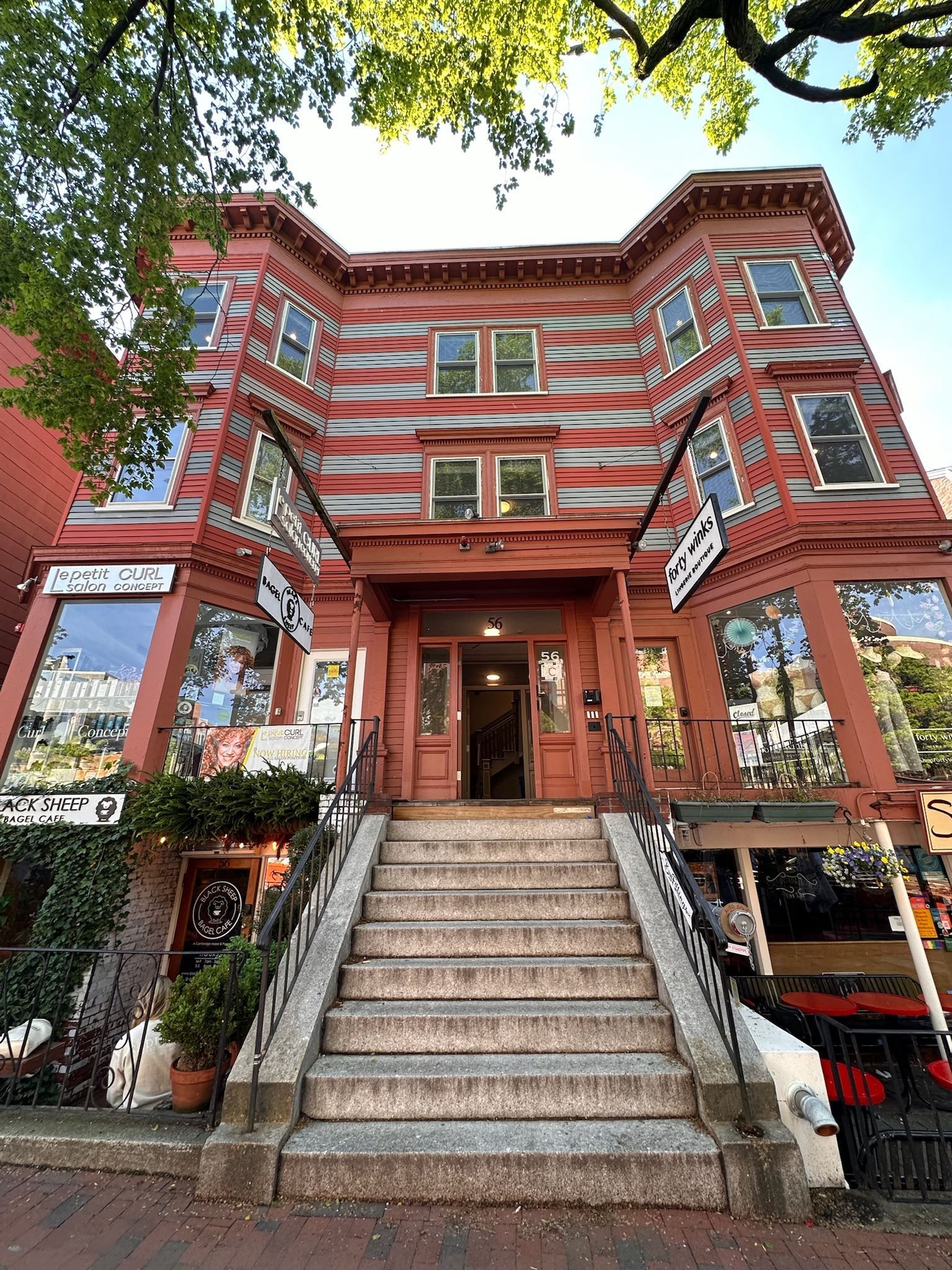 A large red building with stairs leading up to it.
