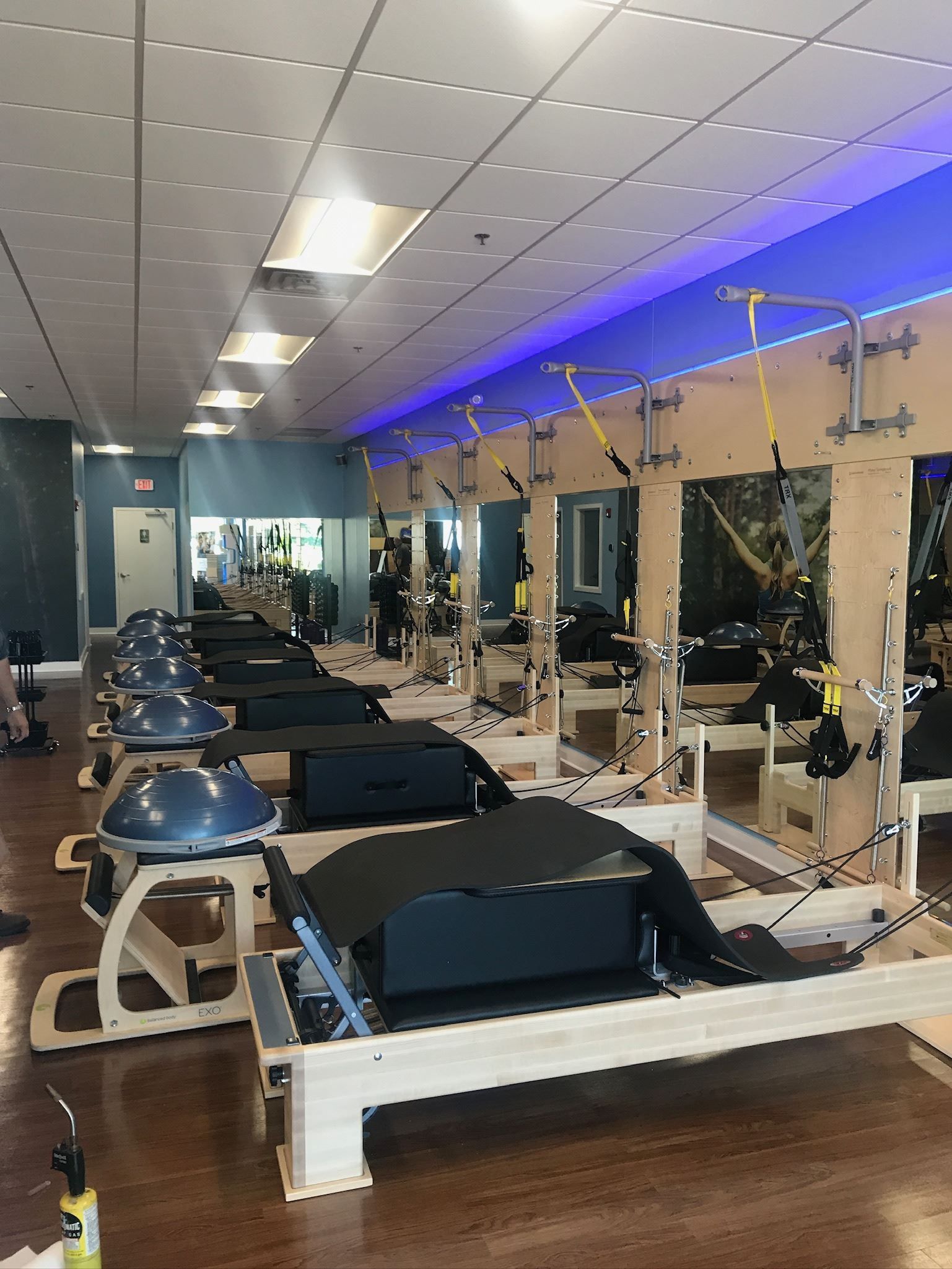 There are a lot of pilates machines in this gym.