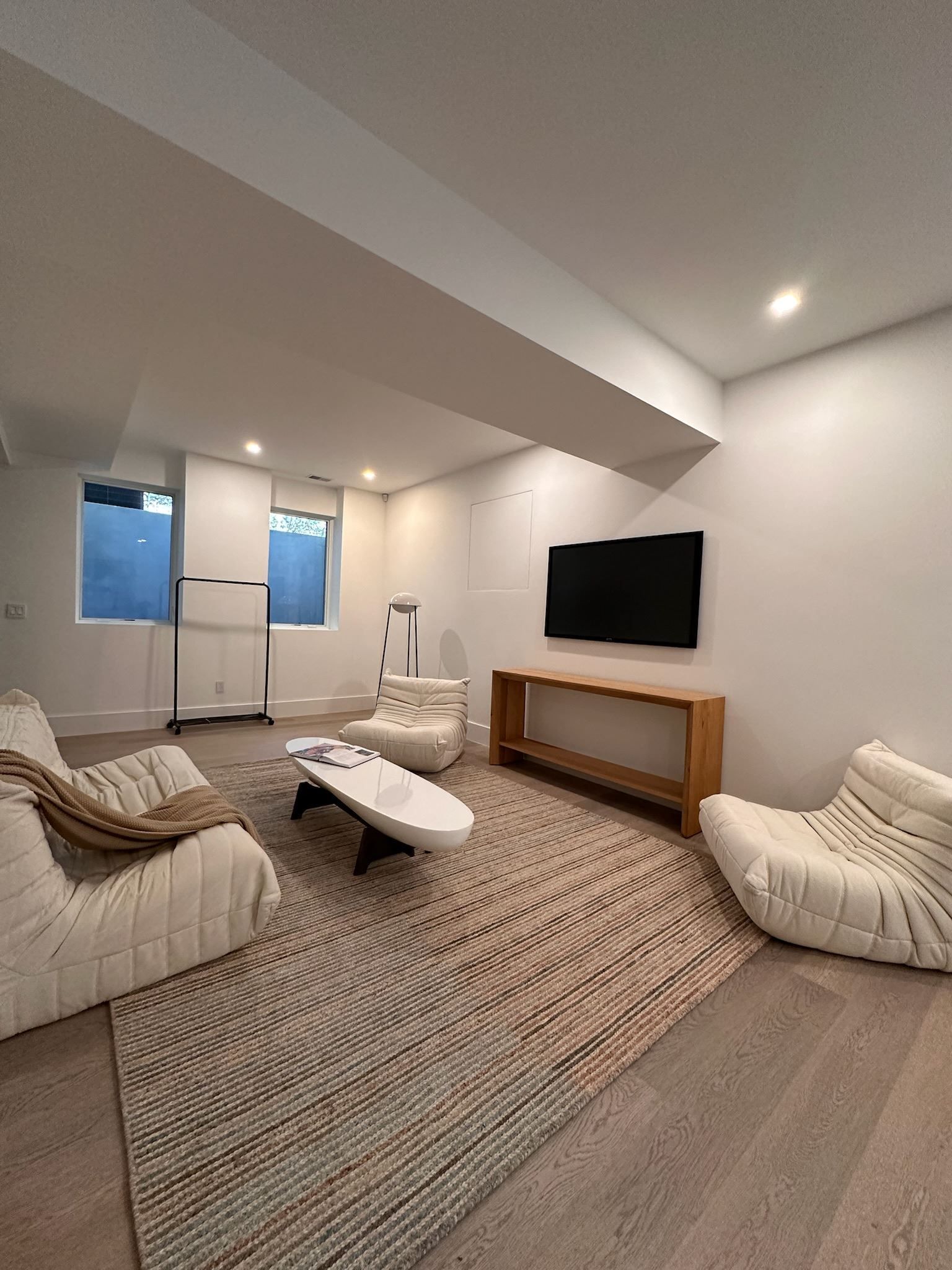 A living room filled with furniture and a flat screen tv.