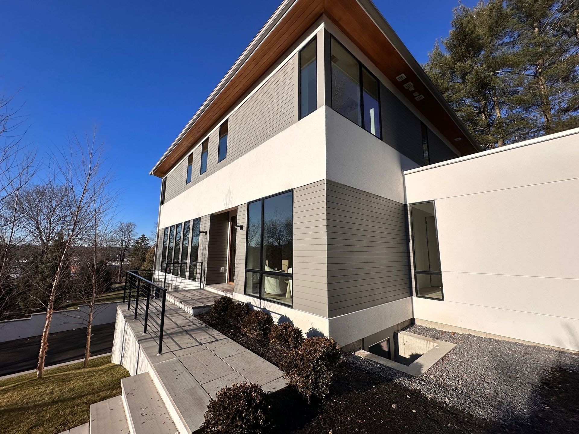 A large building with a lot of windows and stairs leading up to it