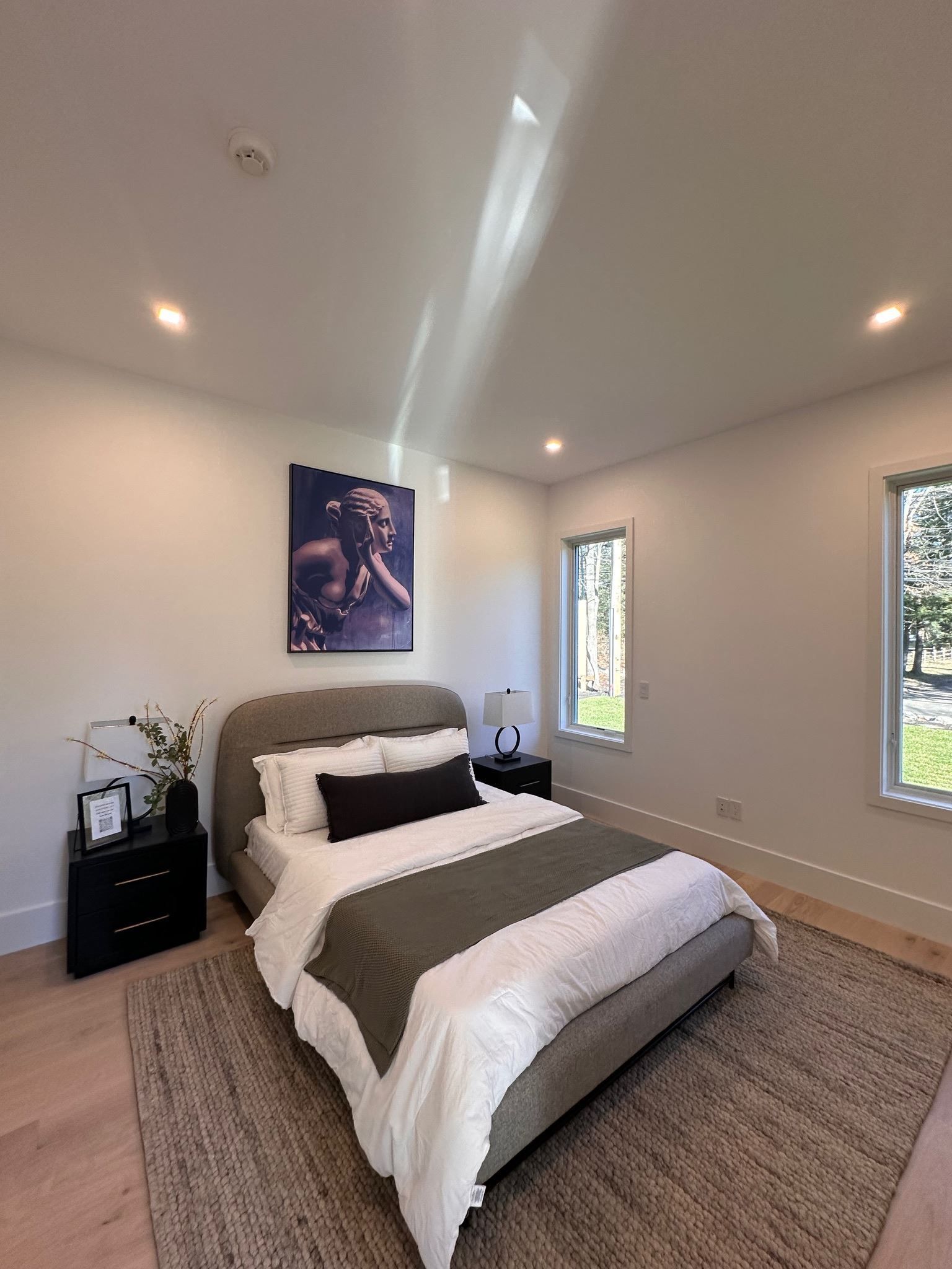 There is a large bed in the middle of the room.