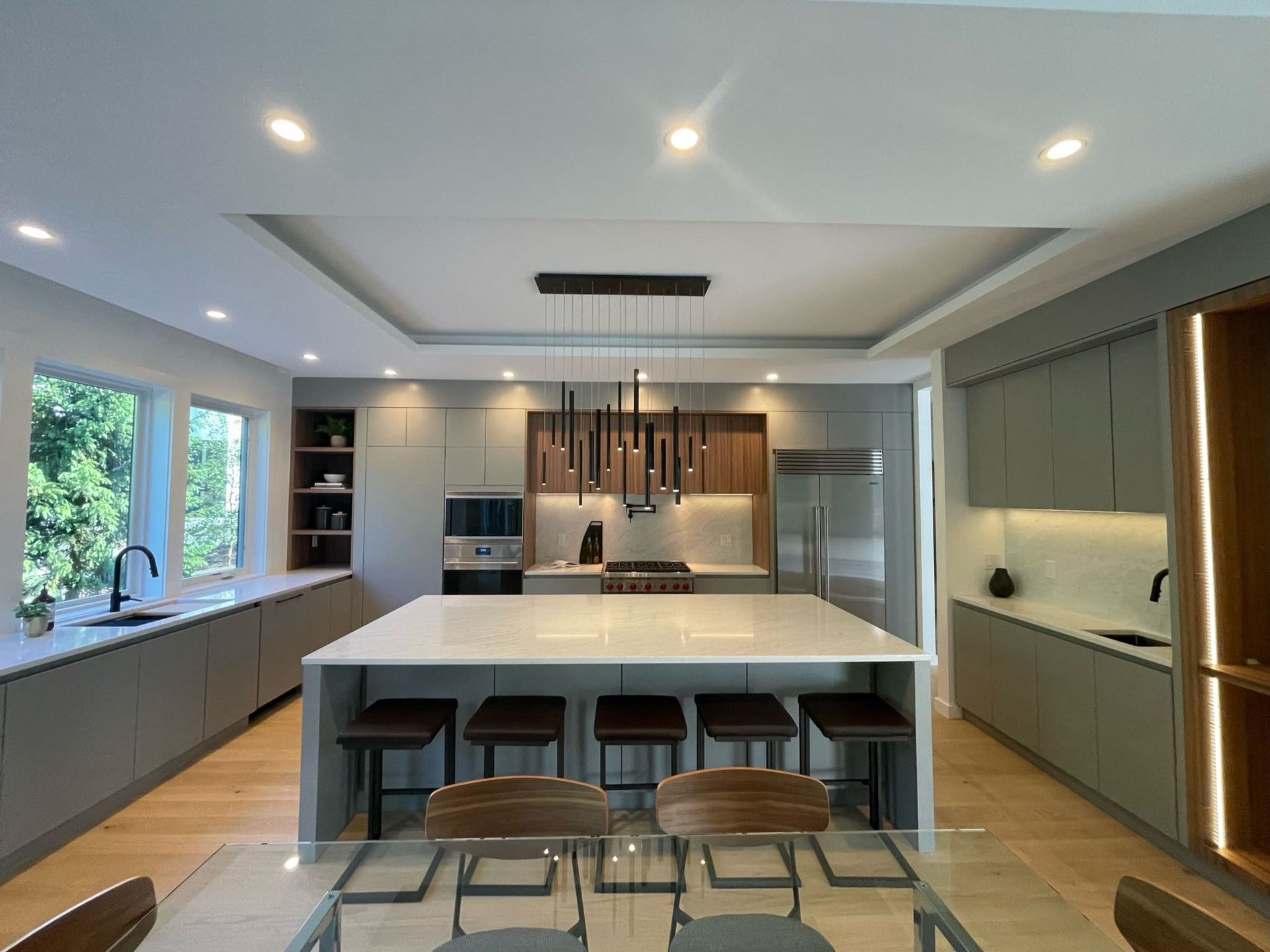 A kitchen with a large island and a dining table