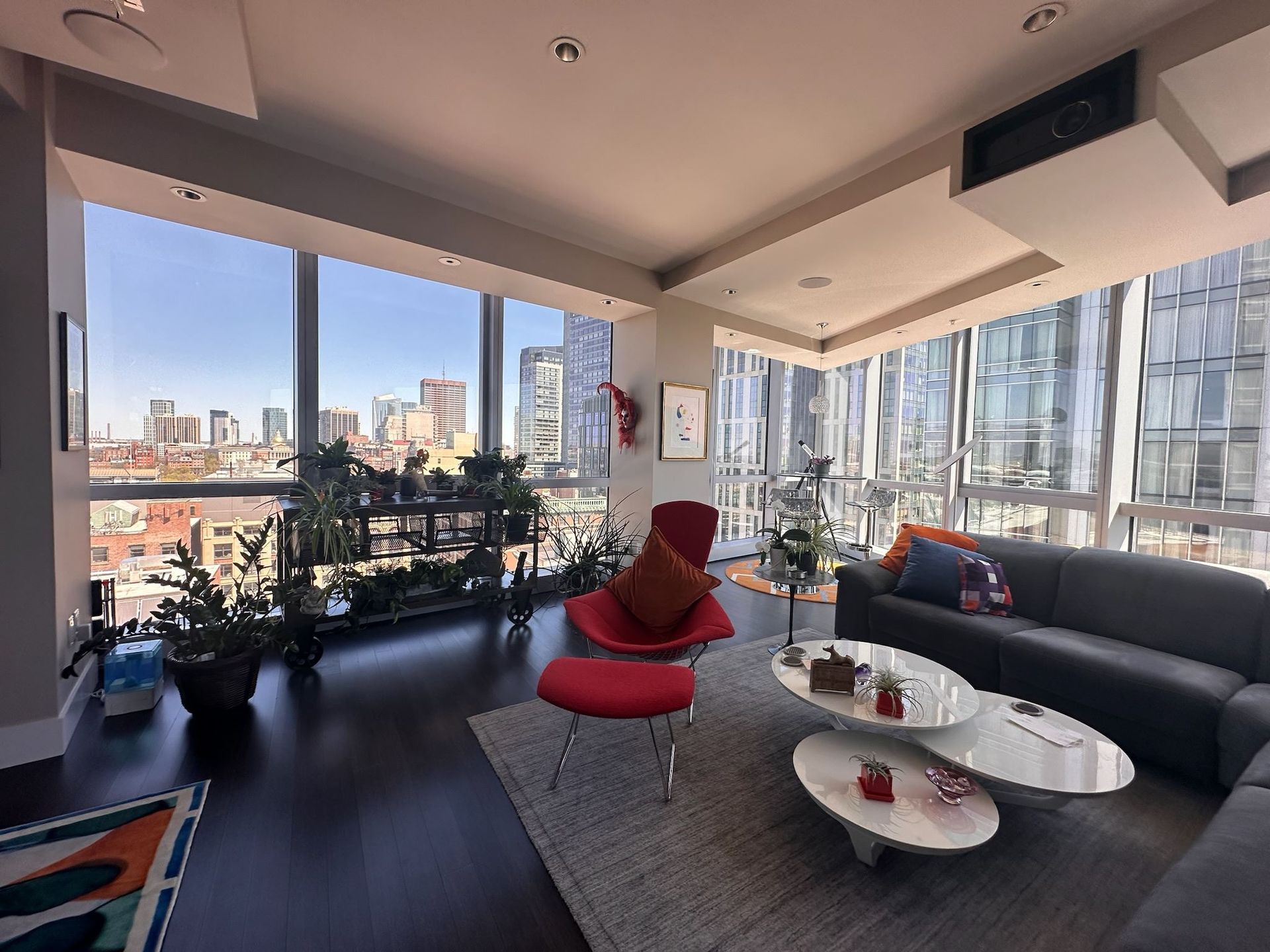 A living room with a couch and two coffee tables