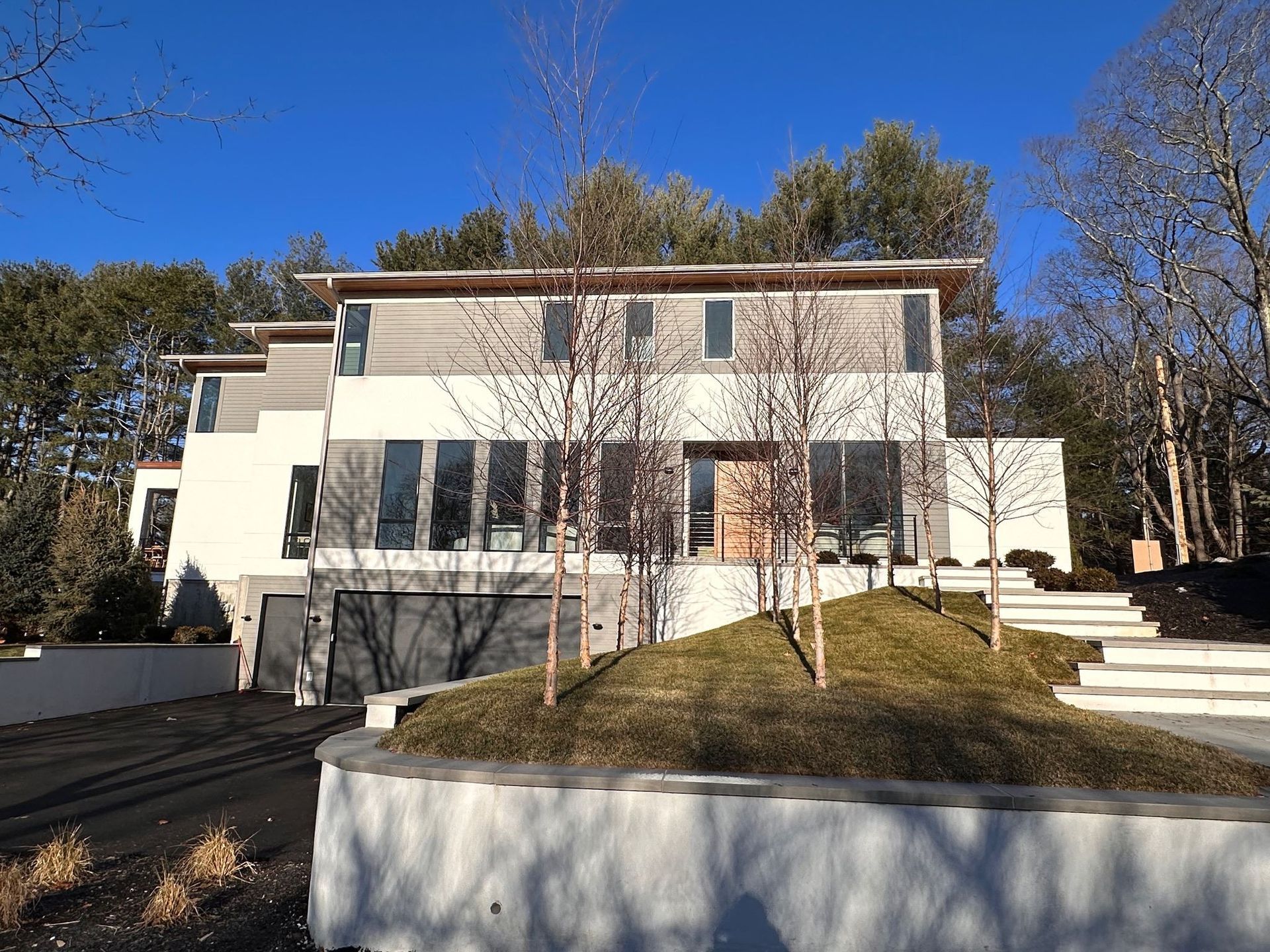A large white house with stairs leading up to it