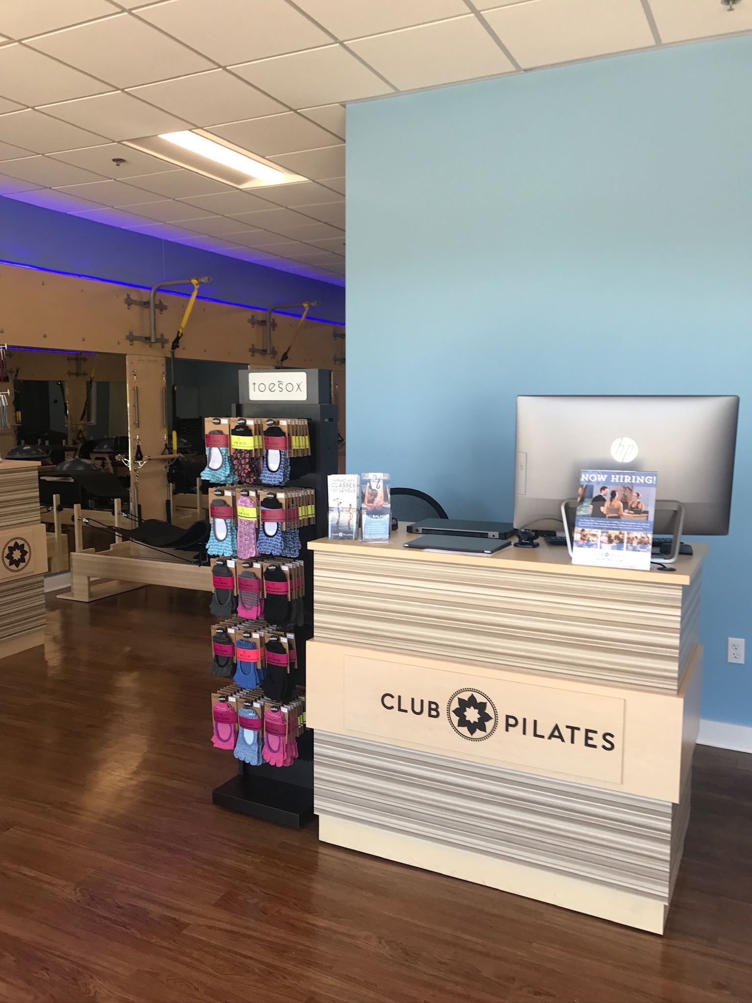 A counter in a gym with a computer on it.