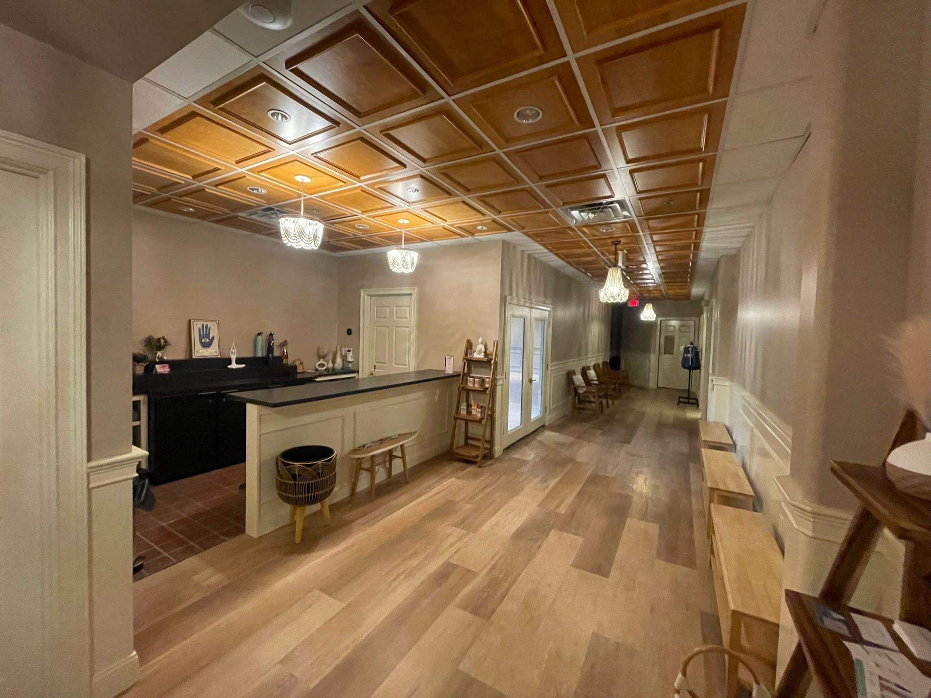 A long hallway with wooden floors and a wooden ceiling.
