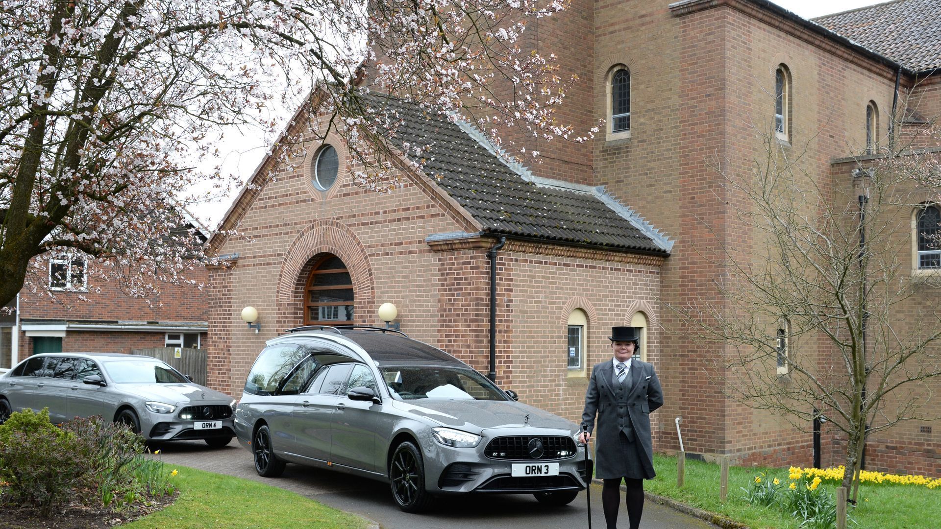 funeral service in front of a local church