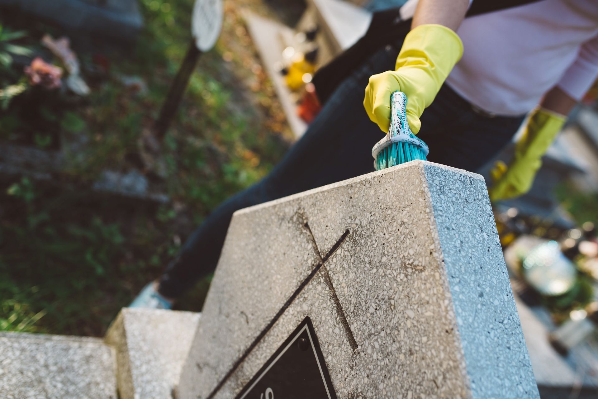 cleaning a gravestone