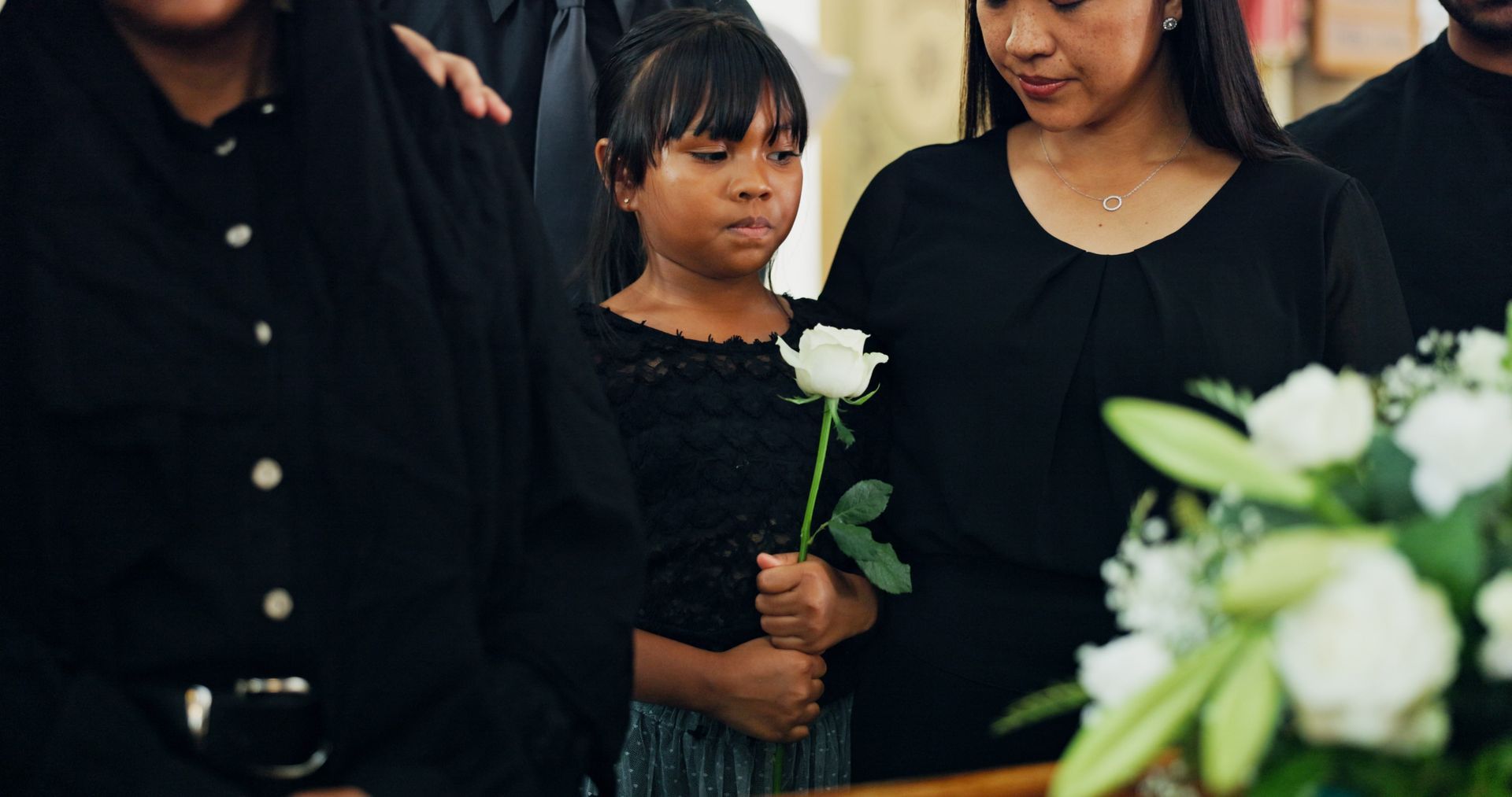 child attending a Funeral 