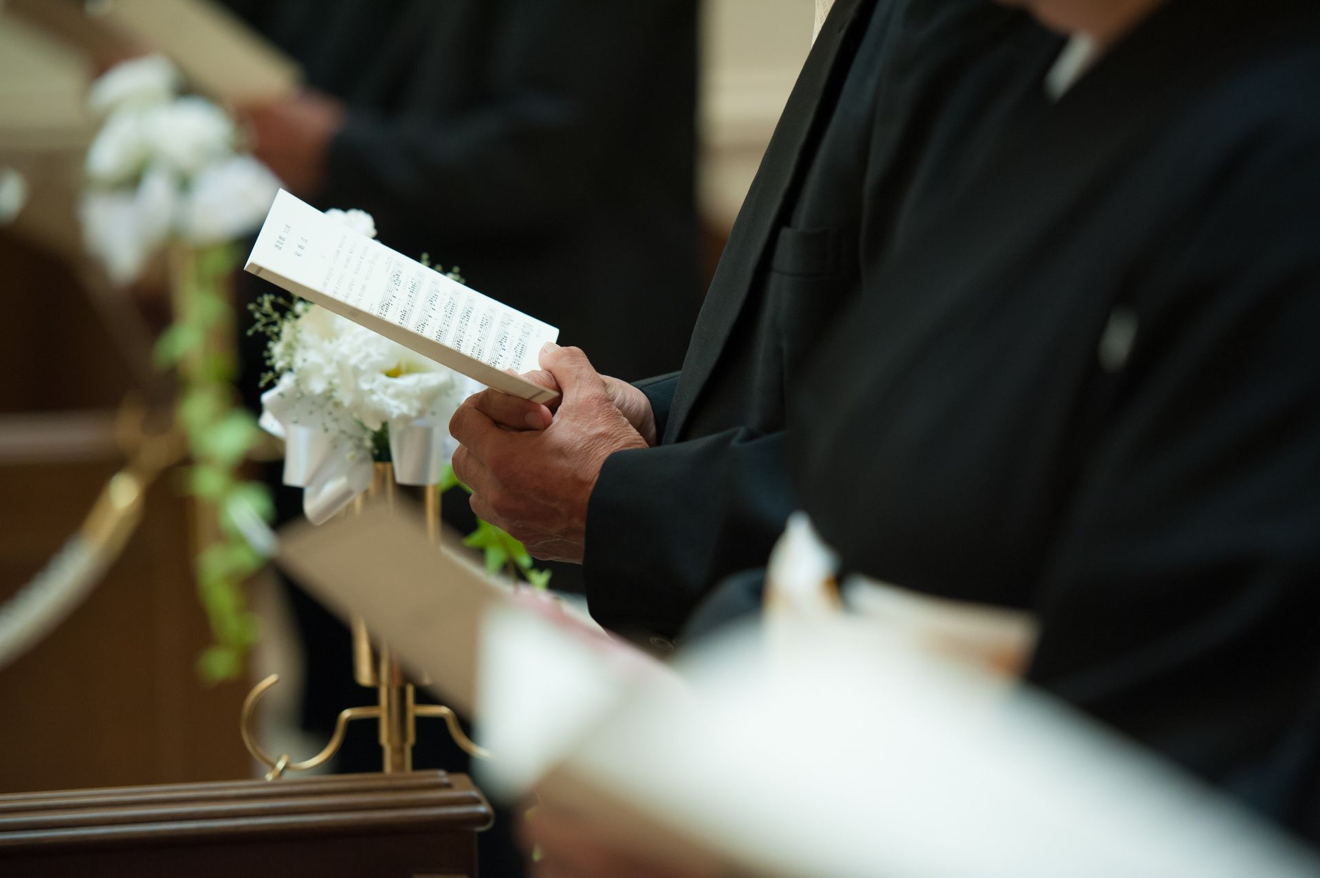 person reading a eulogy at a funeral