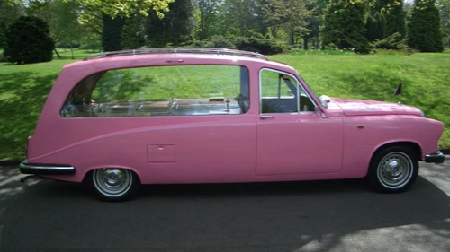 colourful pink vintage hearse