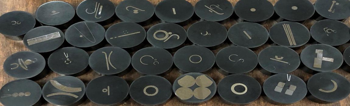 Steel Processing — Black Round Metals with Symbols in Salt Lake City, UT