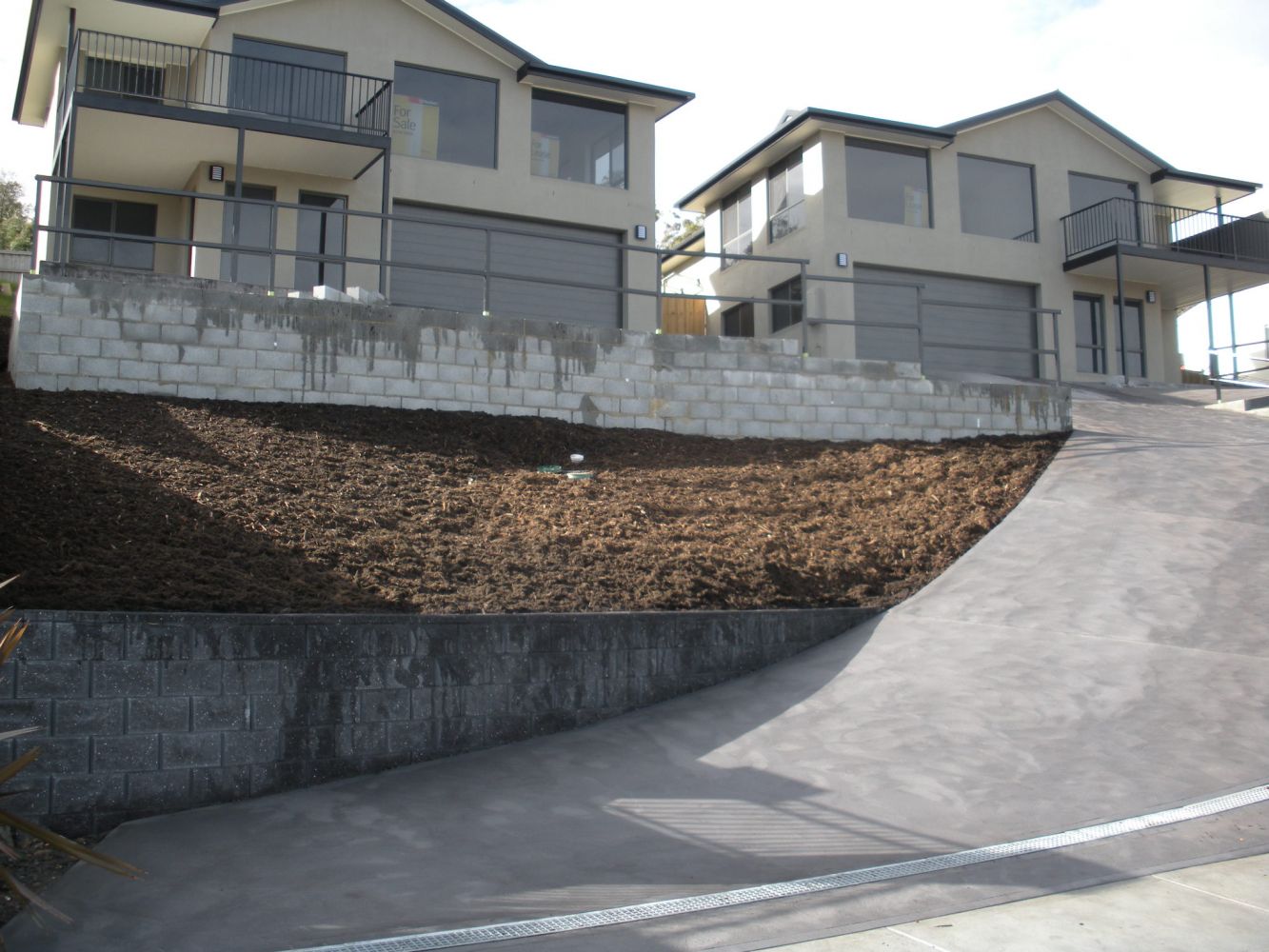 Retaining Wall on a Uphill House — Tasmania — Concrete Concepts Tasmania Pty Ltd