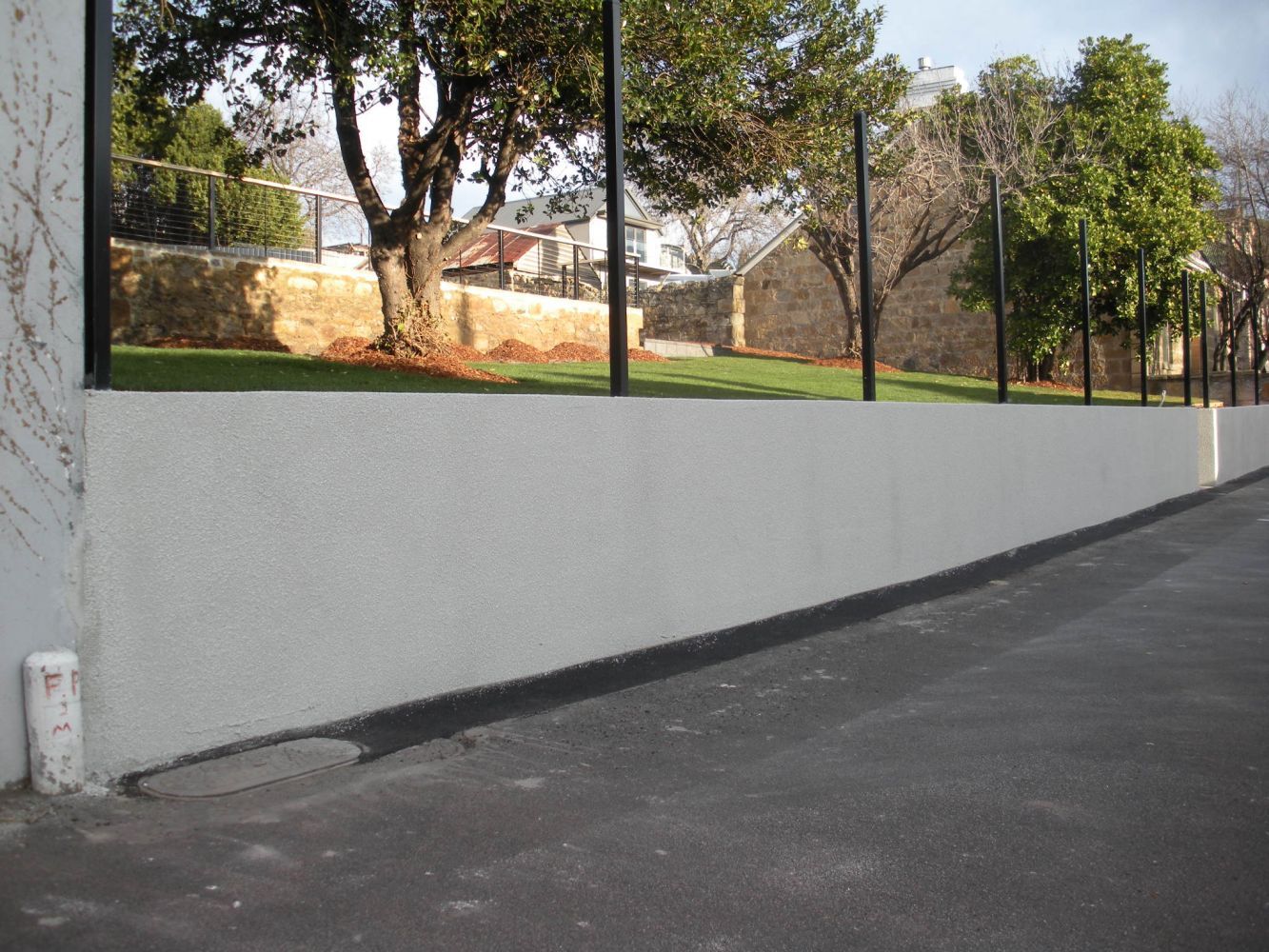 Retaining Wall with White Painting — Tasmania — Concrete Concepts Tasmania Pty Ltd