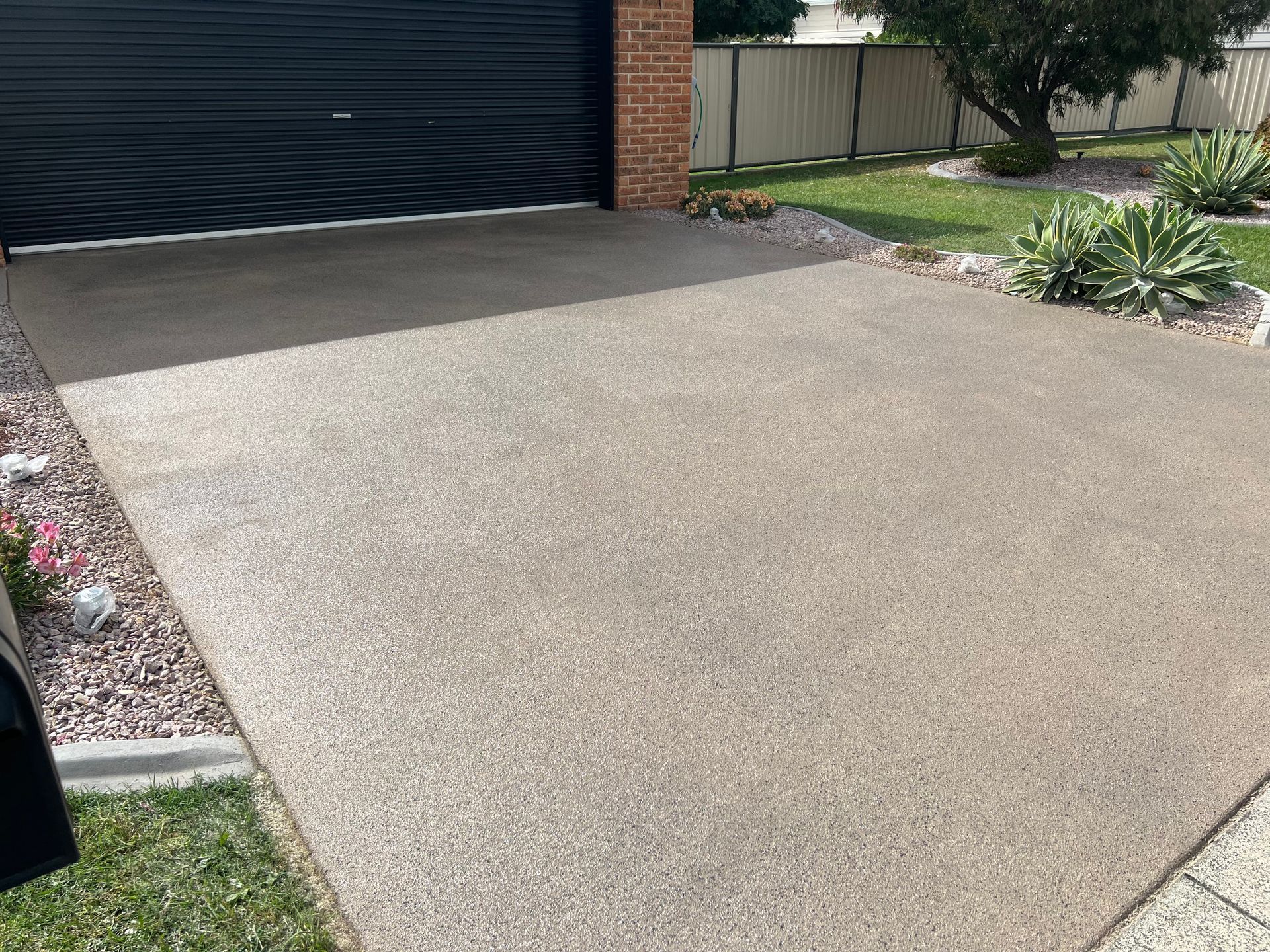 A Concrete Driveway Leading to Garage — Tasmania — Concrete Concepts Tasmania Pty Ltd