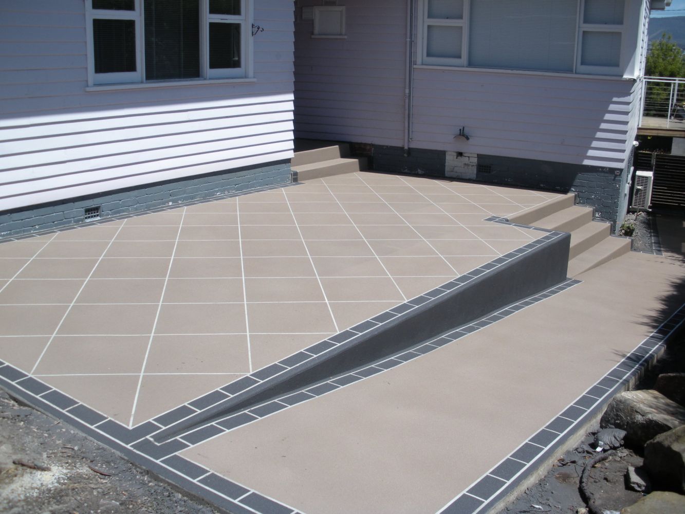 Brown Coloured Concrete Paving with Gray Outline Style — Tasmania — Concrete Concepts Tasmania Pty Ltd