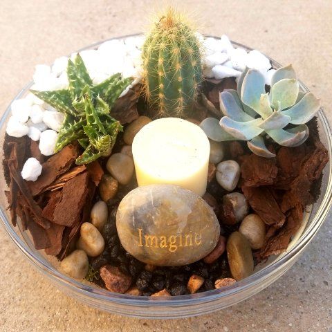 a rock with the word imagine on it