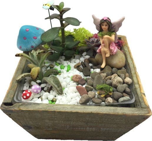 a fairy is sitting on a rock in a small garden