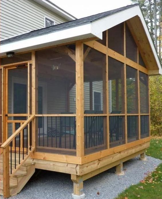 a screened in porch with stairs leading up to it